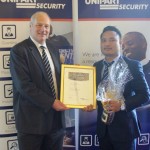 Mark Tonks (left) presents Yubraj Gurung with the Security Officer of the Year Award
