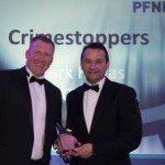 Crimestoppers CEO Mark Hallas accepts the award from the Police Federation National Detectives’ Forum's chairman Martin Plummer