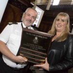 Julie Edwards, operations manager for Selfridges, accepts GMP's Business Crime Co-ordinator of the Year Award from ACC Garry Shewan