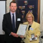 Brian Dillon FSyI is presented with his award by Baroness Ruth Henig